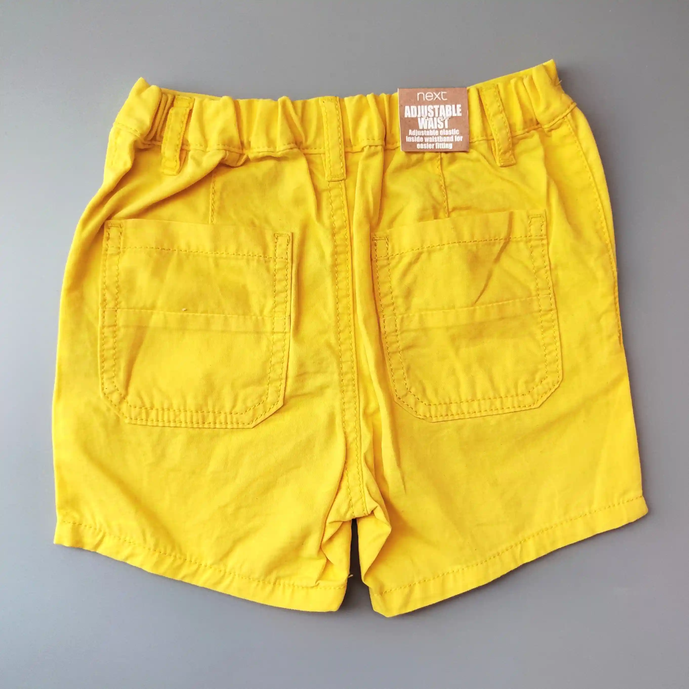 Chino kraťasy Next vel. 92 žluté