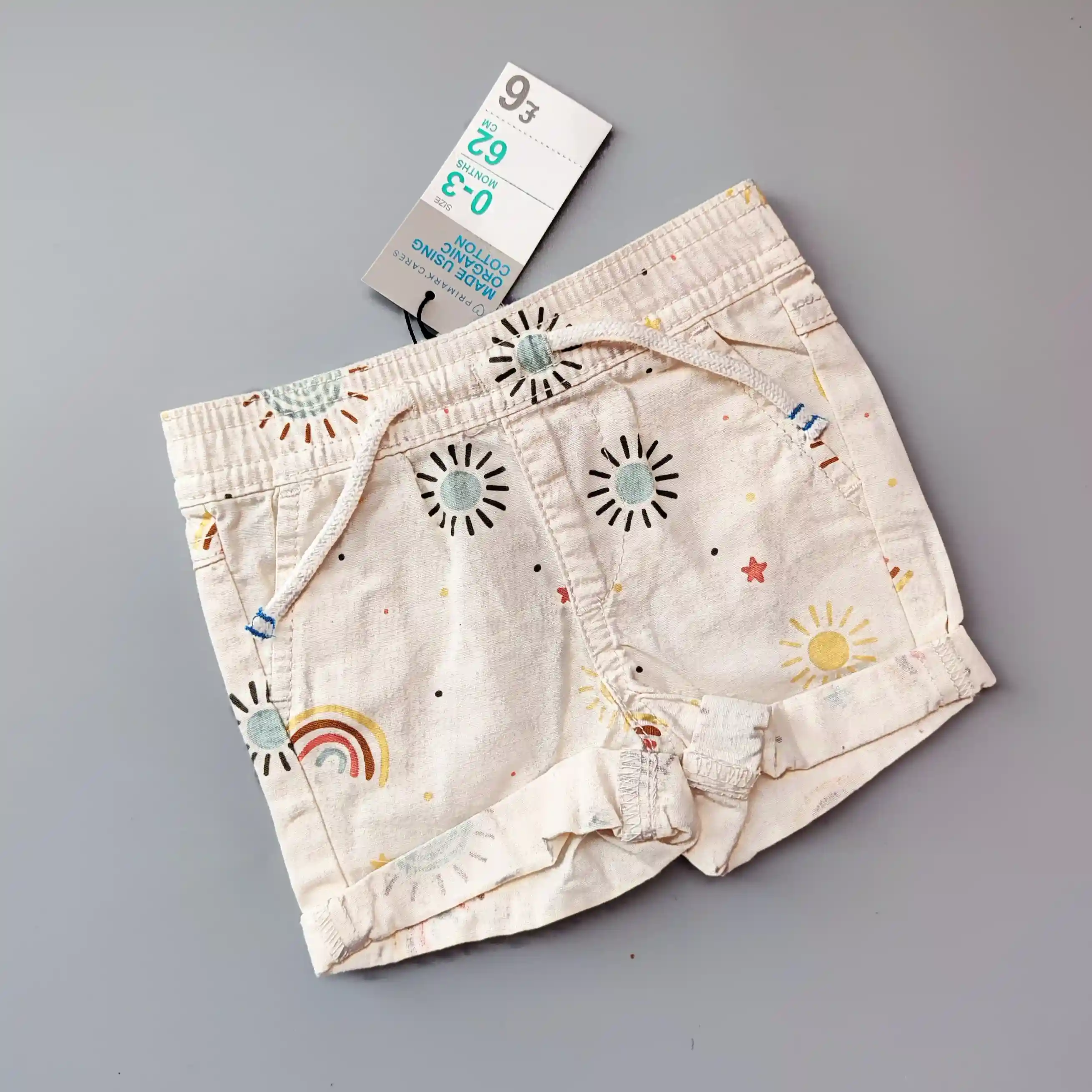 Plátěné kraťasy Primark vel. 62 krémové se sluníčky