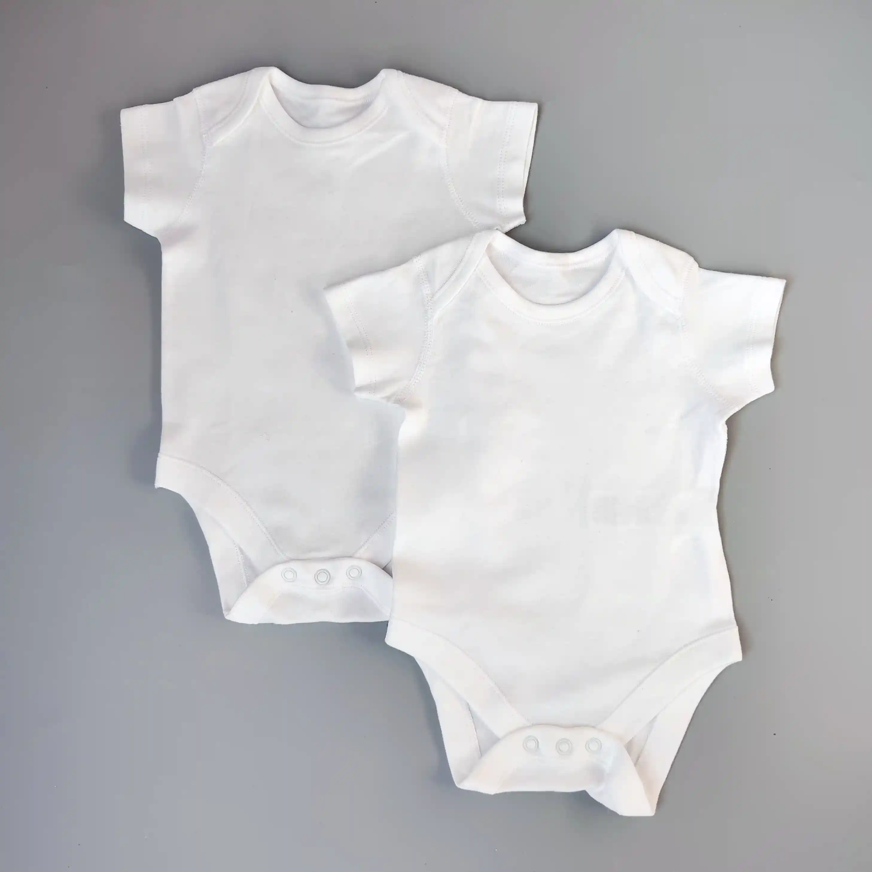 Set dvou body M&S vel. 62 bílé s krátkým rukávem