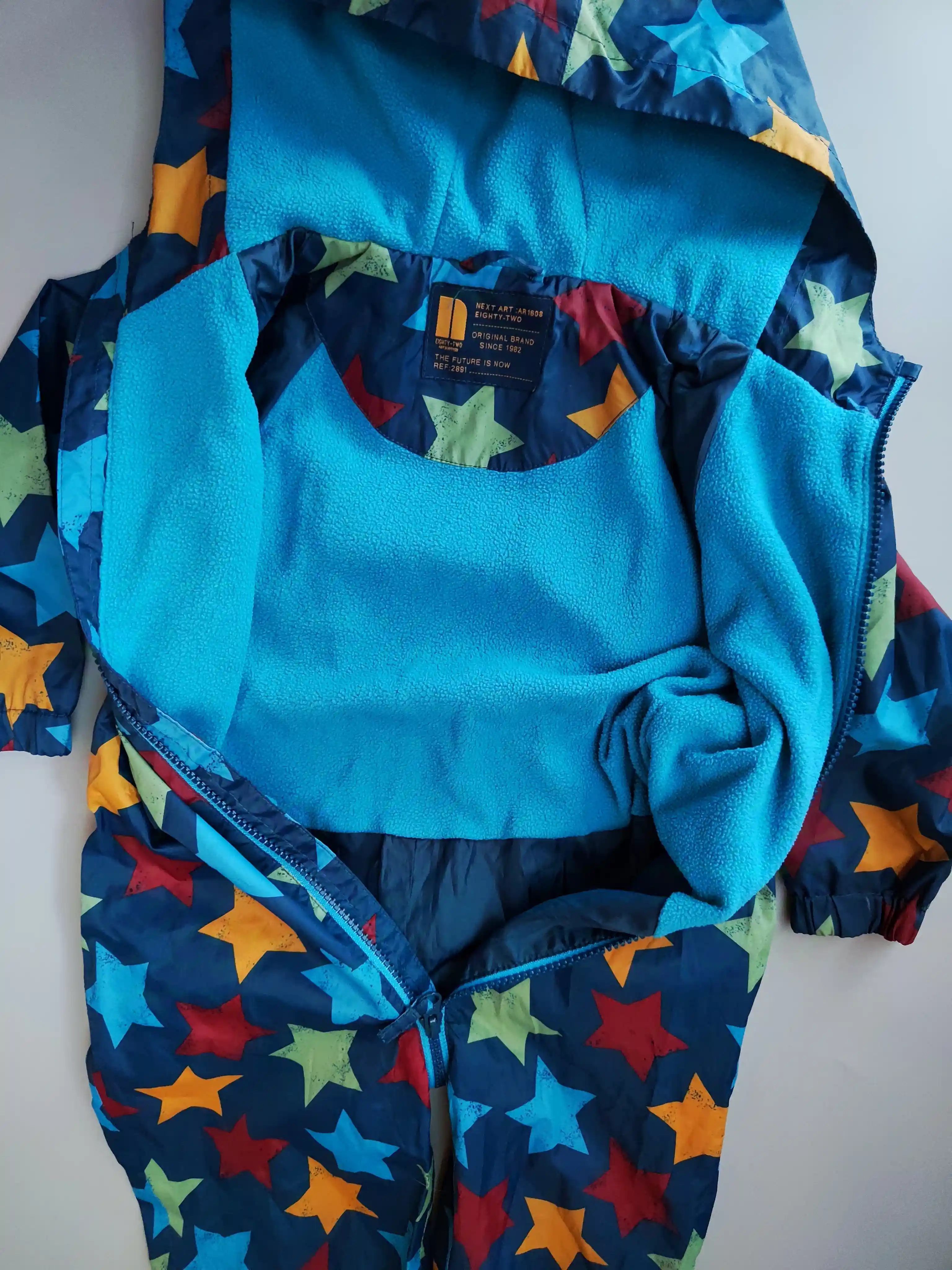 Kombinéza Next vel. 98 tmavě modrá s hvězdami