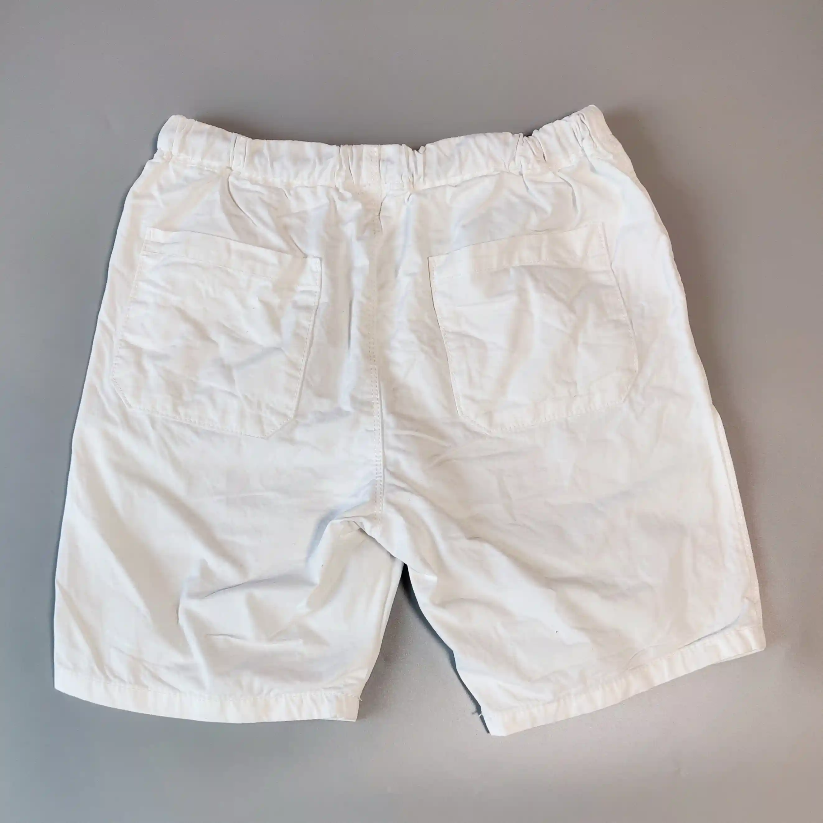 Plátěné kraťasy Next vel. 140 bílé