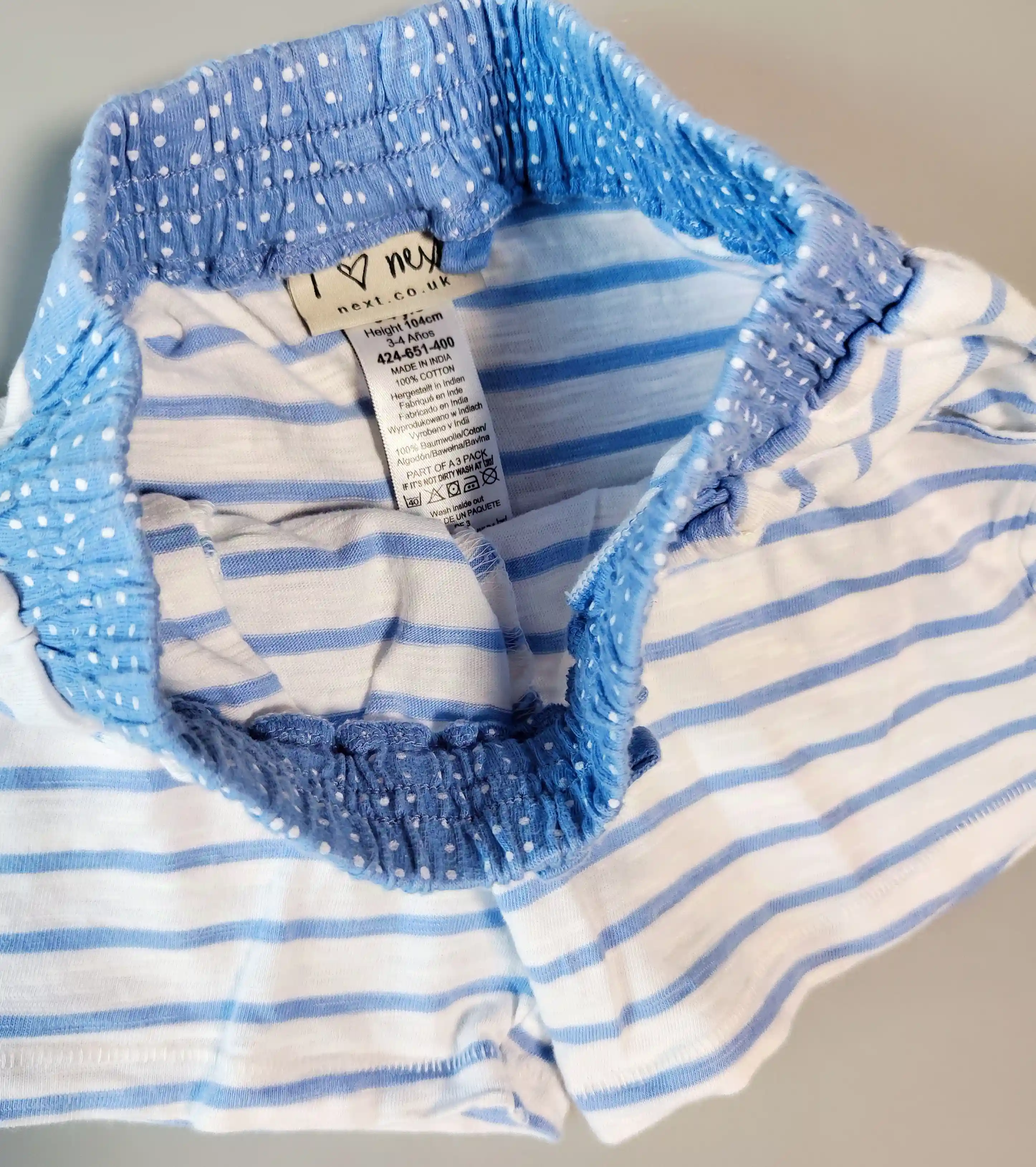 Bavlněné kraťasy Next vel. 104 modrobílé pruhované