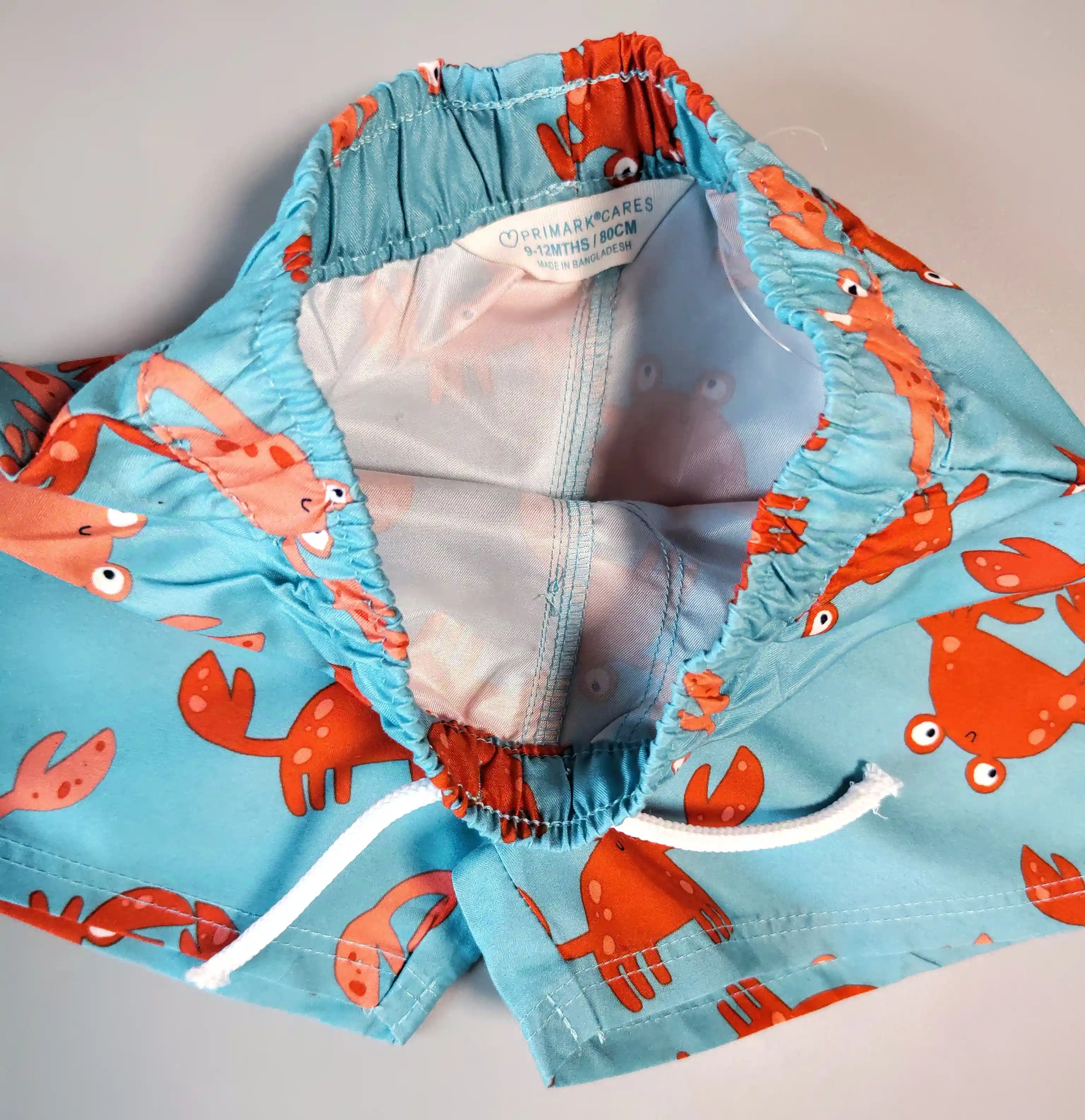 Koupací kraťasy Primark vel. 80 tyrkys s kraby