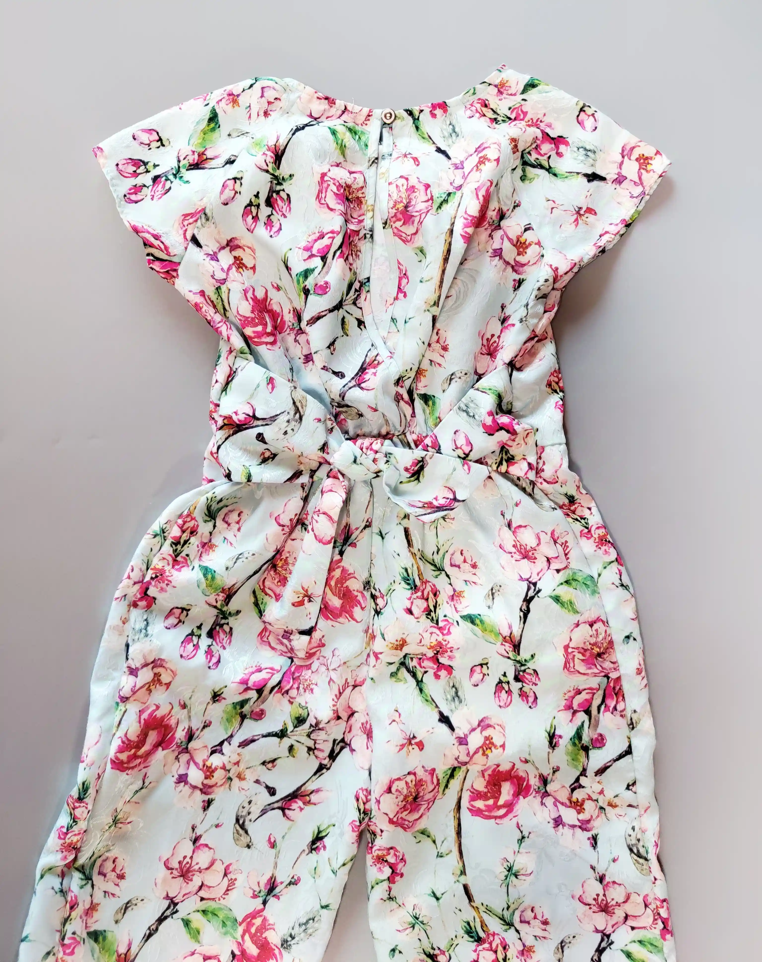 Slavnostní lehký kalhotový overal Matildas Warderobe vel. 128 světle modrý květovaný