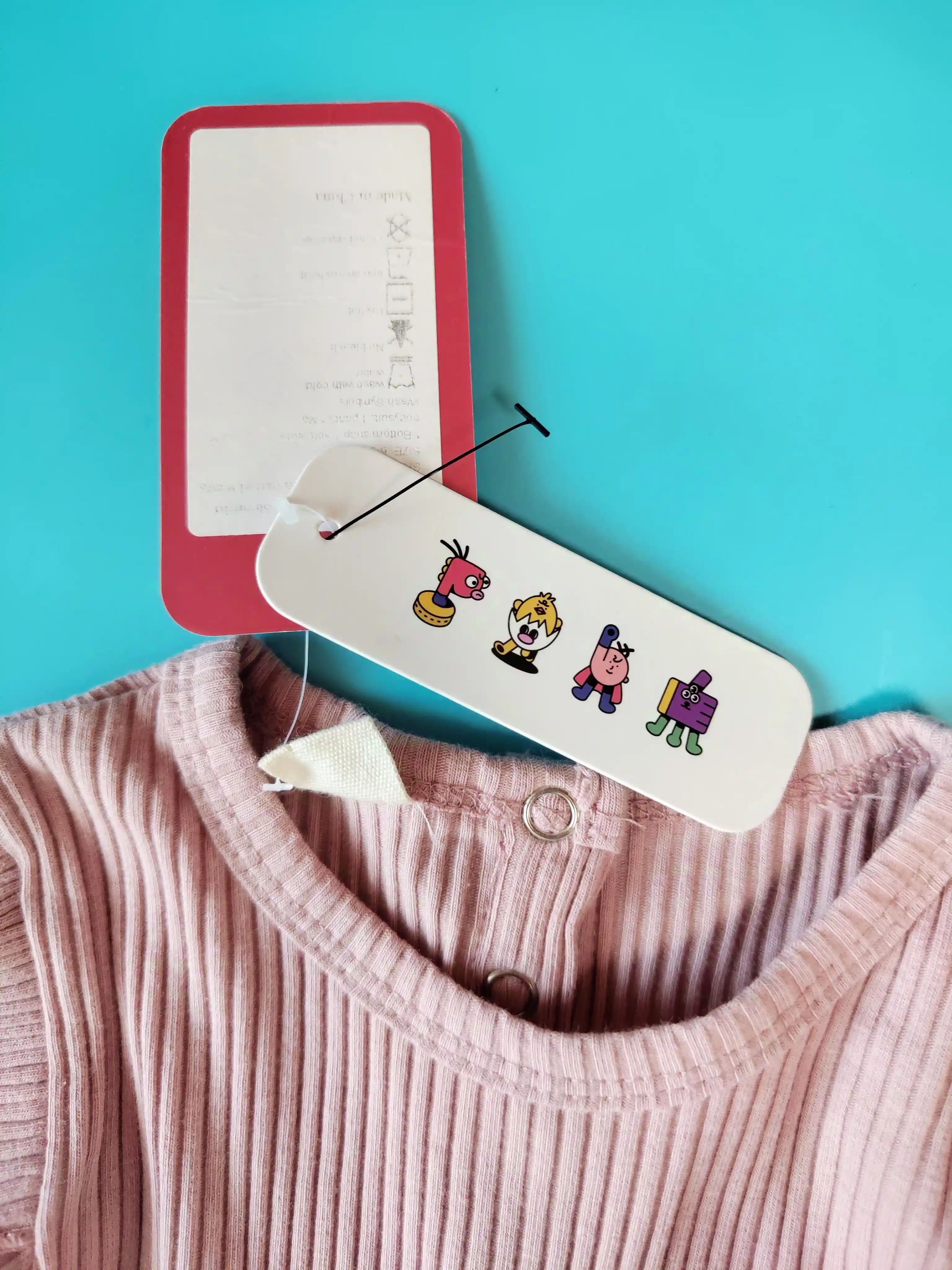 Žebrované body s volánky vel. 6 - 9 měs růžové